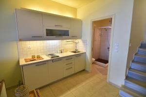 A kitchen or kitchenette at Blue Bay View - Beach House