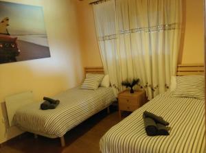 Ένα ή περισσότερα κρεβάτια σε δωμάτιο στο Raitana