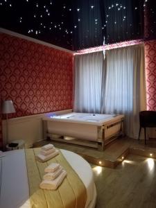 Postel nebo postele na pokoji v ubytování Hotel Terre Dei Salici
