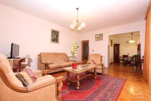 a living room with a couch and a table at Apartment Clementina in Višnjan