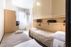 Postel nebo postele na pokoji v ubytování Suite Carpiano