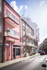 a row of buildings on a city street at Dream city home 2 in Caldas da Rainha