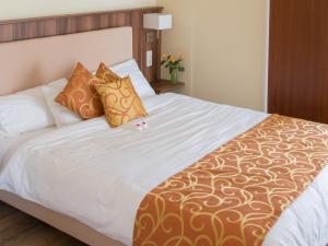 Postel nebo postele na pokoji v ubytování Ducky’s Restaurant | Events | Hotel + 25 fotografií