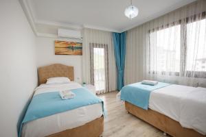 Кровать или кровати в номере North Pearl Residence