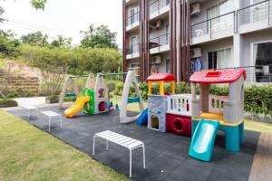 a playground with a slide and a play set at Studio Condo in Replay E305 - across the road from Bangrak Beach SDV210-By Samui Dream Villas in Bangrak Beach