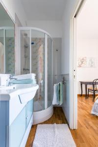 a bathroom with a glass shower and a sink at B&B Terramare in Castorano