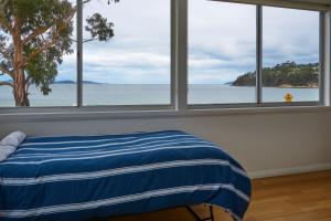 Cama o camas de una habitación en The Ultimate Beach House