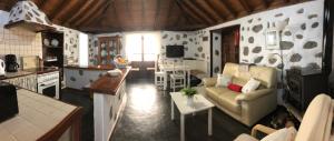 
a living room filled with furniture and appliances at Casa Rural Macrina in Adeje
