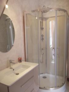 a bathroom with a shower and a sink at Auberge du Morvan in Alligny-en-Morvan