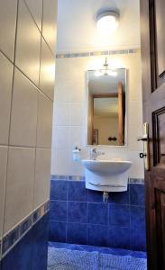 a bathroom with a sink and a mirror at Hydra Optima in Hydra +19 photos