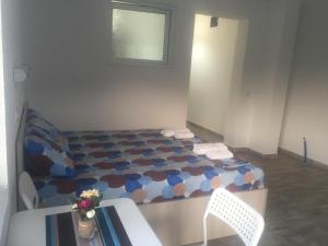 Postel nebo postele na pokoji v ubytování Apartmani Alex Beach
