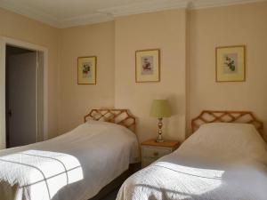 A bed or beds in a room at Crag House 