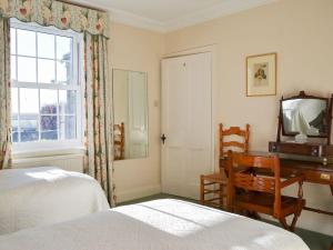 A bed or beds in a room at Crag House 