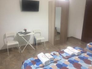Postel nebo postele na pokoji v ubytování Apartmani Alex Beach