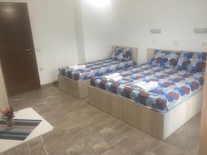 Postel nebo postele na pokoji v ubytování Apartmani Alex Beach