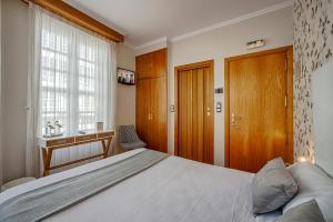 Posteľ alebo postele v izbe v ubytovaní Hostal Zahara