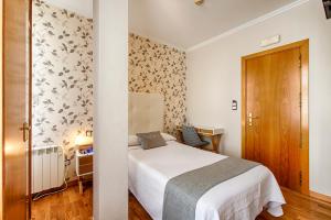 Posteľ alebo postele v izbe v ubytovaní Hostal Zahara