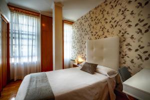 Posteľ alebo postele v izbe v ubytovaní Hostal Zahara