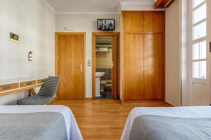 Posteľ alebo postele v izbe v ubytovaní Hostal Zahara