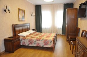 
Кровать или кровати в номере Hotel Kokshebel

