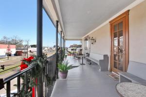 a balcony of a building with a view of a street at The Bank Hotel in Lake Arthur