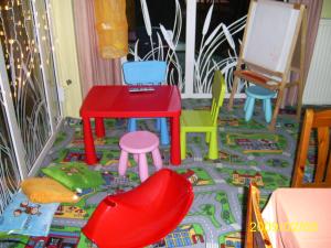 a toy room with colorful chairs and a table at Hotel Flóra** in Orosháza +19 photos