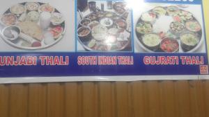 a sign on a wall with different types of food at Alamdar guest house in Srinagar