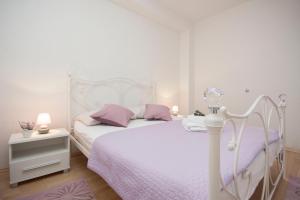 Postel nebo postele na pokoji v ubytování Rooms Katarina