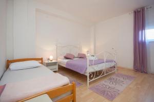 Postel nebo postele na pokoji v ubytování Rooms Katarina