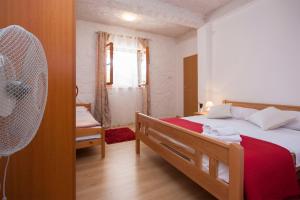 Postel nebo postele na pokoji v ubytování Rooms Katarina