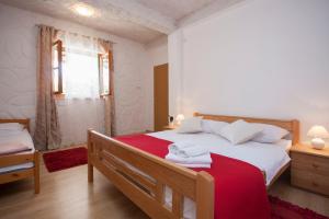 Postel nebo postele na pokoji v ubytování Rooms Katarina