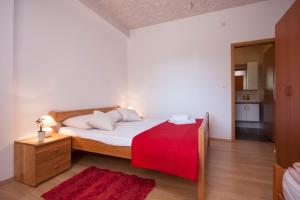 Postel nebo postele na pokoji v ubytování Rooms Katarina