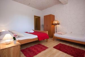 Postel nebo postele na pokoji v ubytování Rooms Katarina