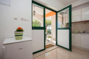 Kuchyň nebo kuchyňský kout v ubytování Rooms Katarina