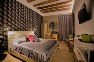 Voodi või voodid majutusasutuse MYO Cagliari Charming House toas