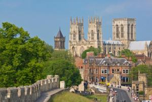 a view of a city with buildings and a castle at The Wesley in York