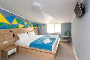 Ліжко або ліжка в номері Blum Hotel