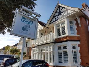 a sign for a beach lodge in front of a house at Beach Lodge in Bournemouth