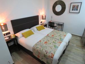 Postel nebo postele na pokoji v ubytování Living Sevilla Apartments Hércules