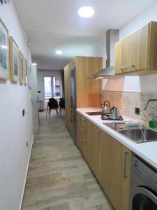 Kuchyň nebo kuchyňský kout v ubytování Living Sevilla Apartments Hércules