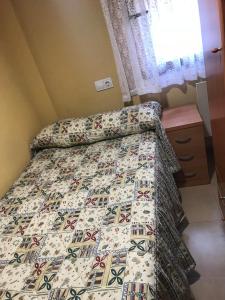 A bed or beds in a room at Pensión la Estación