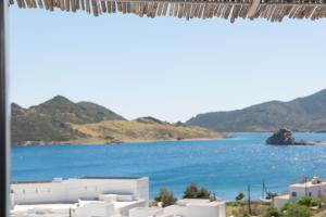 a view of a body of water from a window at Captain Manos Studio Apartments in Grikos