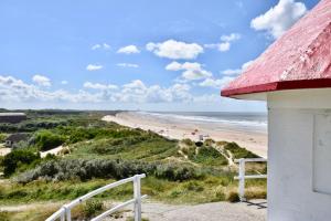 a view of the beach from a house at Tidal Nest - North Sea Stays in Wenduine +20 photos