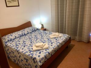 Postel nebo postele na pokoji v ubytování "casa le Palme"