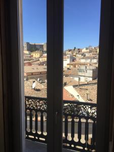 a view of a city from a window at La Casa nel Borgo Antico in Melfi