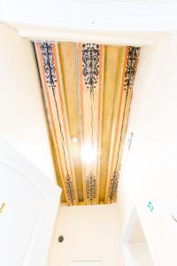 a ceiling in a room with a bunch of curtains at Old Town Hostel Alur in Tallinn