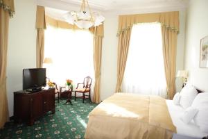 Posteľ alebo postele v izbe v ubytovaní Hotel Mignon