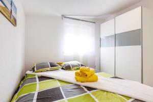 Postel nebo postele na pokoji v ubytování Studio Apartment Maslina