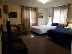 Postel nebo postele na pokoji v ubytování Melsask Motel