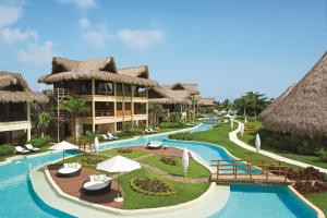 a resort with a swimming pool and a resort at Zoëtry Agua Punta Cana, Punta Cana, Dominican Republic in Punta Cana